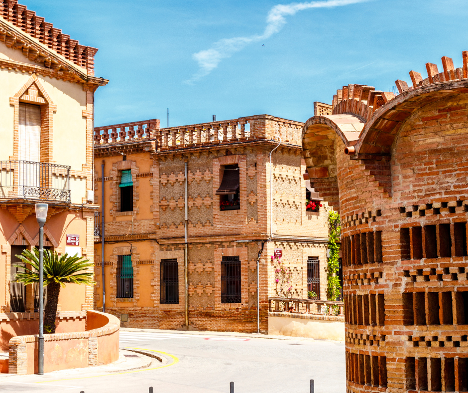 Facade of factory worker houses in Colonia Guell, Barcelona, Catalonia Spain